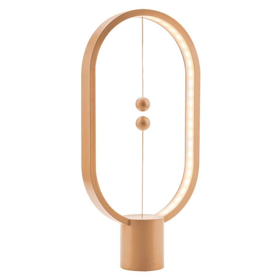 Ovale Tischlampe in Roségold mit zylindrischem Sockel, LED-Lichtstreifen innen und zwei schwebenden Kugeln in der Mitte