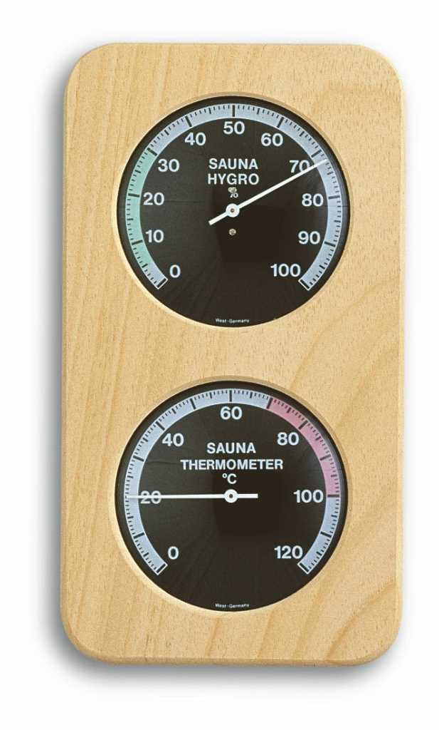 Holzbrett mit zwei runden schwarzen Skalen, oben Hygrometer und unten Thermometer mit Zeigern