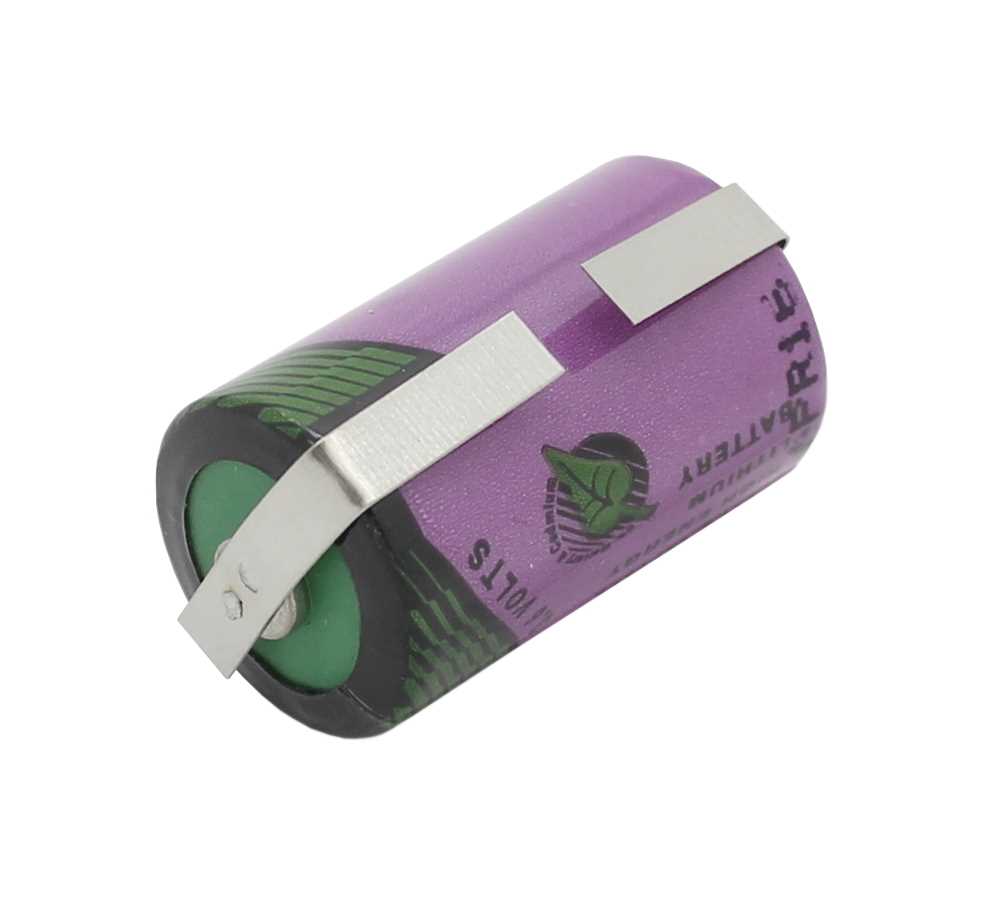 Zylindrische lila Batterie mit zwei Metall-Lötfahnen in U-Form, seitlich liegend, grüner Pol sichtbar